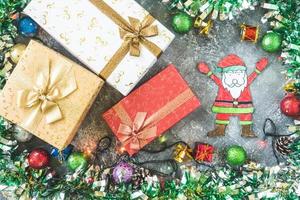 Top view of Gift boxes with Christmas decoration on gray grunge background. photo