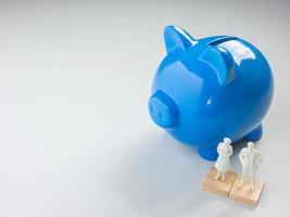 The blue piggy bank on white background for saving or business concept photo