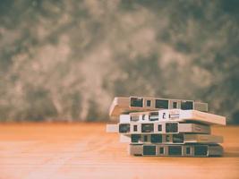 Cassette tapes over wooden table with grunge background.retro filter. photo