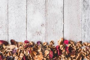 Top view of  Dried flowers on wooden table background .Free space for your text photo