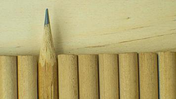 The wood pencils on wood table for background content. photo