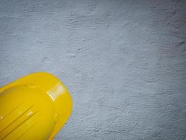 Hard Hats Yellow Cap Mine Safety Appliances on  cement floor photo