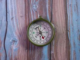 compass on wood table for tourist or travel concept photo