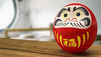 muñeca japonesa daruma en la representación 3d de la mesa de madera foto