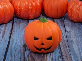 pumpkin jack on wood table for halloween or holiday concept photo