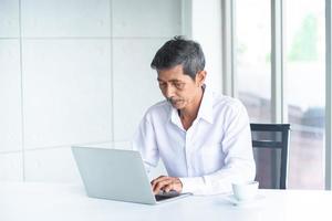 Asian Business old man  in the meeting room at the office photo