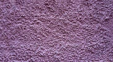 Pink stone grain wall spray painted texture concrete background in retro style with copy space photo