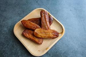 Dried bananas on a plate photo