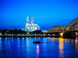 HDR St Peter Cathedral and Hohenzollern Bridge over river Rhine photo