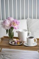 Tray with breakfast on bed. photo