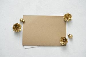 Mockup for a letter or a wedding invitation with fir-cone. photo