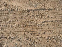 tyre footprint in soil background photo