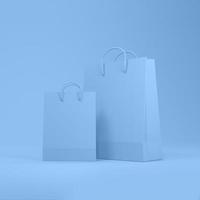 Shopping bags in blue background with space for text or design. photo