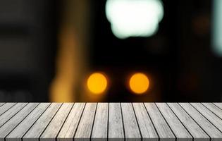 Blurred background of bar and white wooden table desk. photo