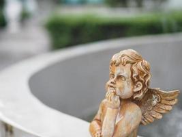 Cubic stucco doll in the fountain photo