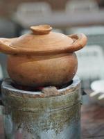 Earthenware pots are located on the charcoal stoves photo