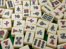 The mahjong on table ancient asian board game close up image photo