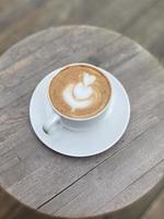 Hot coffee cup on table photo