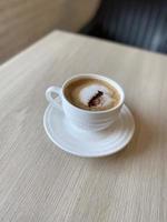 Hot coffee cup on table photo