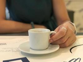 Hot coffee cup on table photo