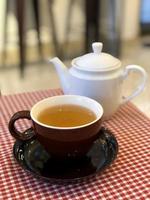 Hot tea cup on table photo