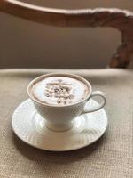 Hot coffee cup on table photo