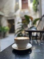 Hot coffee cup on table photo