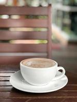 Hot coffee cup on table photo