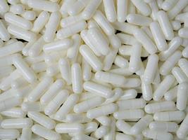 The white capsules image  for  sci or medical content. photo