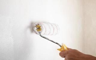 paint roller for painting walls, house renovation concept photo