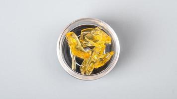 box of golden cannabis concentrate, yellow medical marijuana wax photo