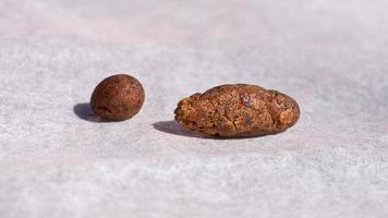 brown pieces of hashish on paper, cannabis trichomes photo