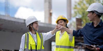 Team job of teamwork engineer work together in a construction site with business concept. photo