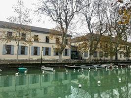 Beautiful River Channel with Boats Houses  and Trees photo