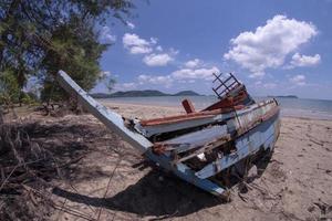 Storm damage. Fishing boat are damaged. Boat collapsed. photo