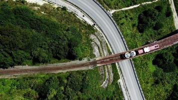 Aerial top down view of a water tank train on a bridge video