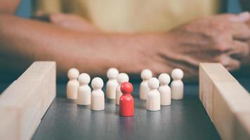 wooden blocks lined up behind businessmen The concept of teamwork and business strategy by managing and developing it step by step The competition is planned based on professional marketing data. photo