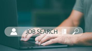 Searching for jobs and employment with online networking technology, recruiting careers and jobs from companies via the Internet, business people find information and new jobs through laptops. photo