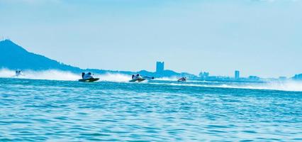 CHONBURI, THAILAND-NOVEMBER 26, 2017 F3 boat with beautiful sky and sea and city view in Bangsaen Power Boat 2017 at Bangsaen beach in Thailand photo