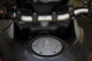 Gas tank of motorcycle. Details of bike. Cover on gas tank. photo