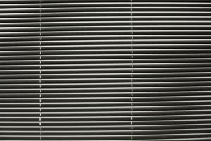 Blinds on window. Daylight through slats of blinds. photo