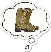 cartoon cowboy boots and thought bubble as a distressed worn sticker vector