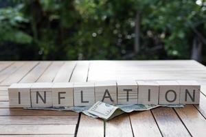 Inflation word cube. Idea for the Fed to consider raising interest rates. Global Economy and Inflation Control US dollar inflation. photo