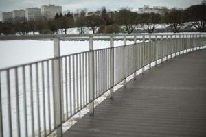 Details of promenade in winter. Urban architecture. Street on winter day. photo