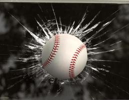 Baseball through broken window photo