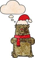 cartoon bear wearing christmas hat and thought bubble in grunge texture pattern style vector