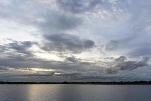 The clouds filled the sky, obscuring the light from the sun during the sunset. photo