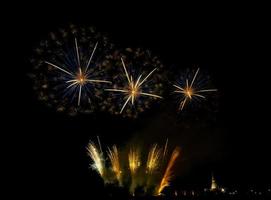 Huge, colorful fireworks over the rice fields at dusk. photo