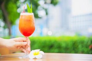 Cocktail recipe name mai tai or mai thai worldwide favour cocktail include rum lime juice orgeat syrup and orange liqueur - sweet alcohol drink with flower in garden relax vacation concept photo