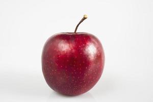 Fresh colorful apple over gray background - clean fresh fruit background concept photo